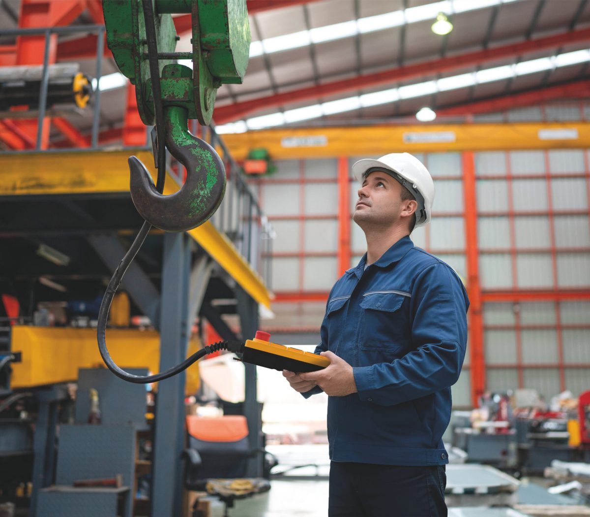 woman engineer working and checking system machine at factory.